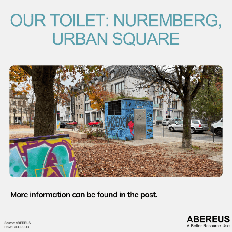 Our toilet at the urban square. The toilet is now covered with graffiti. Leaves are all of the ground as it is fall.